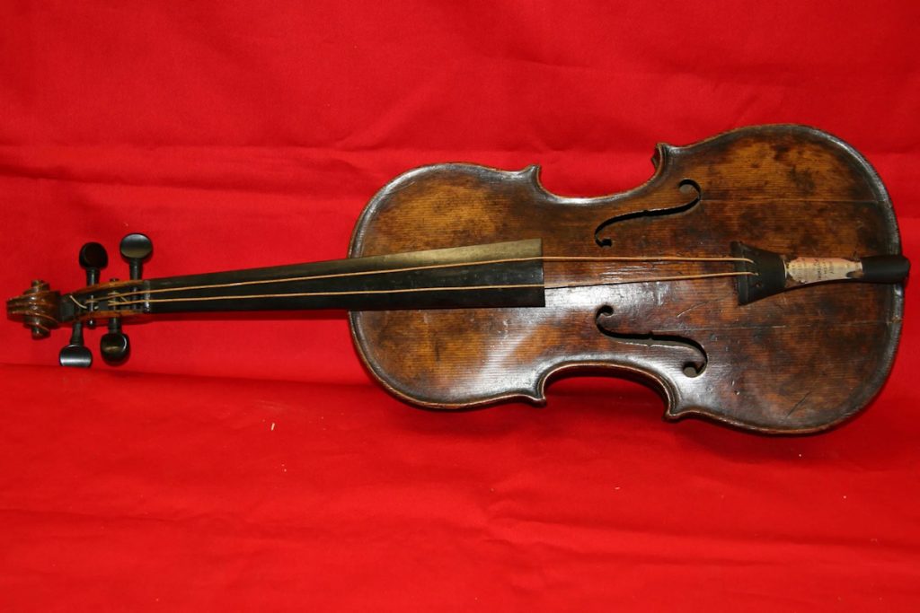 scrap metal discards valuable violin