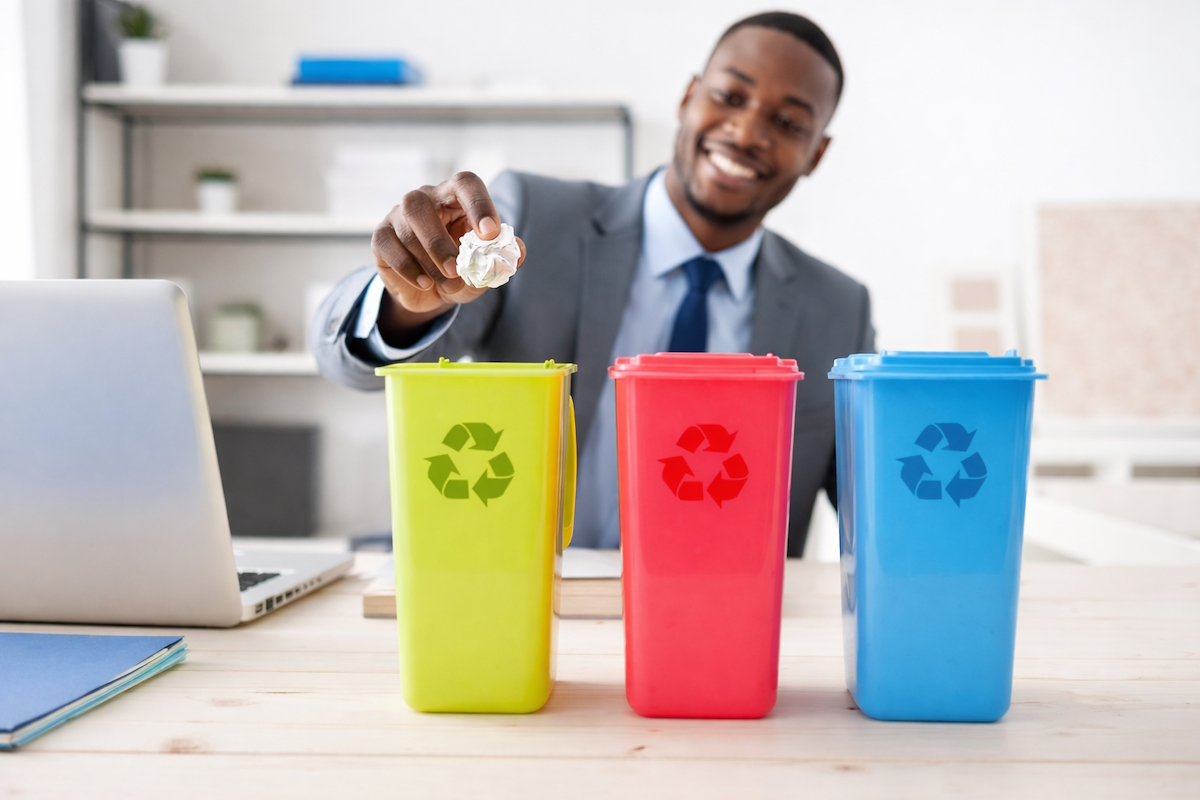 reduce waste workplace businessman recycling at office desk ai