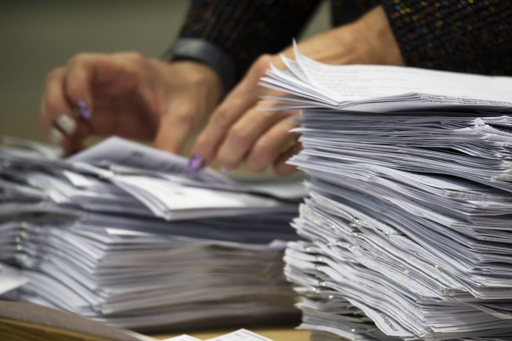 reduce waste workplace office paper stacks