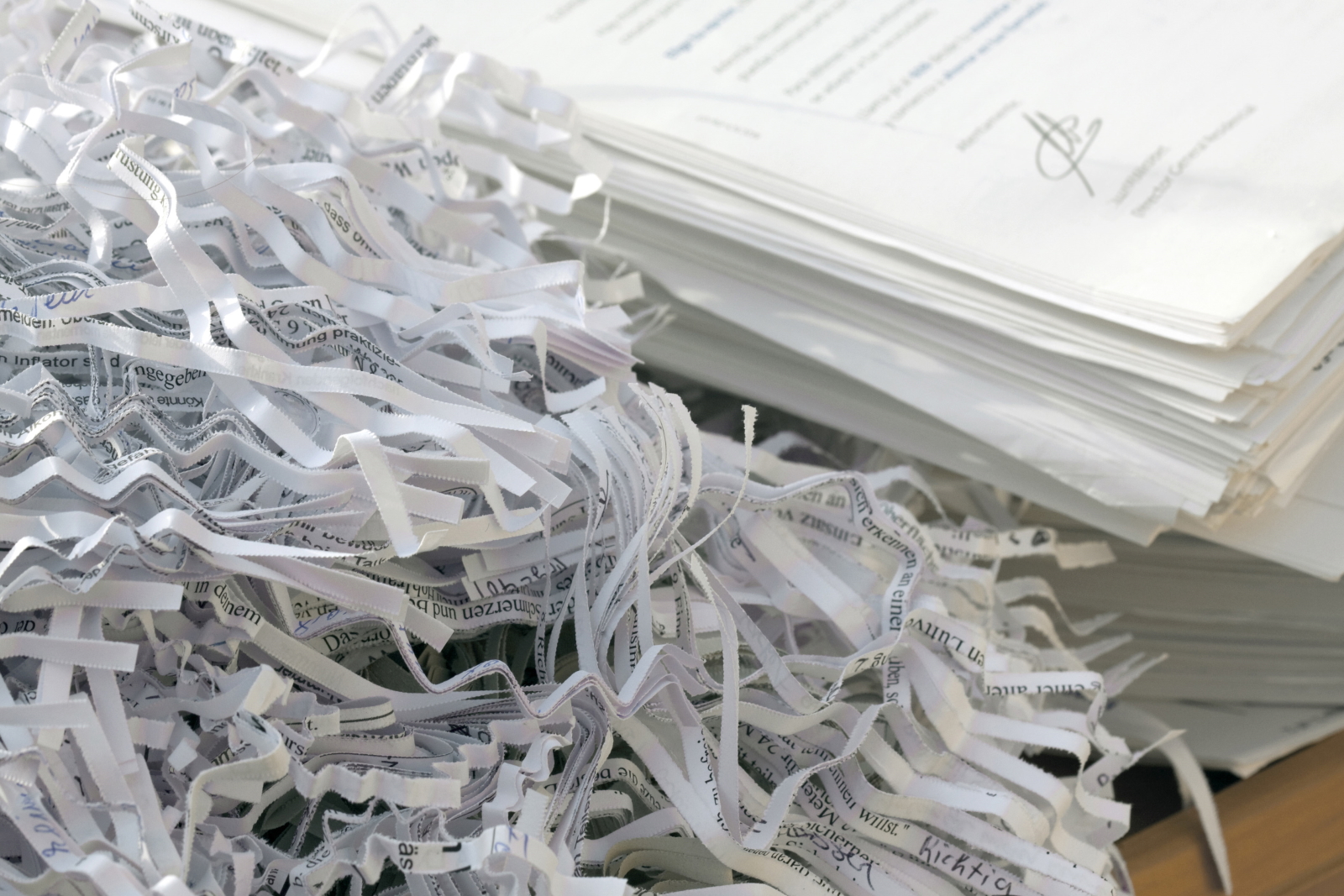 paper shredding confidential documents being shredded